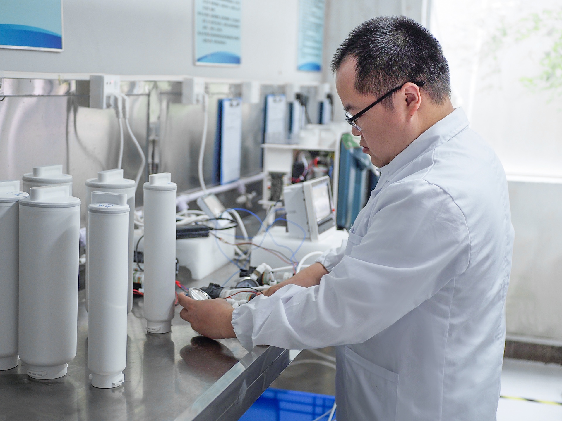 An engineer evaluating filtration components in the laboratory.