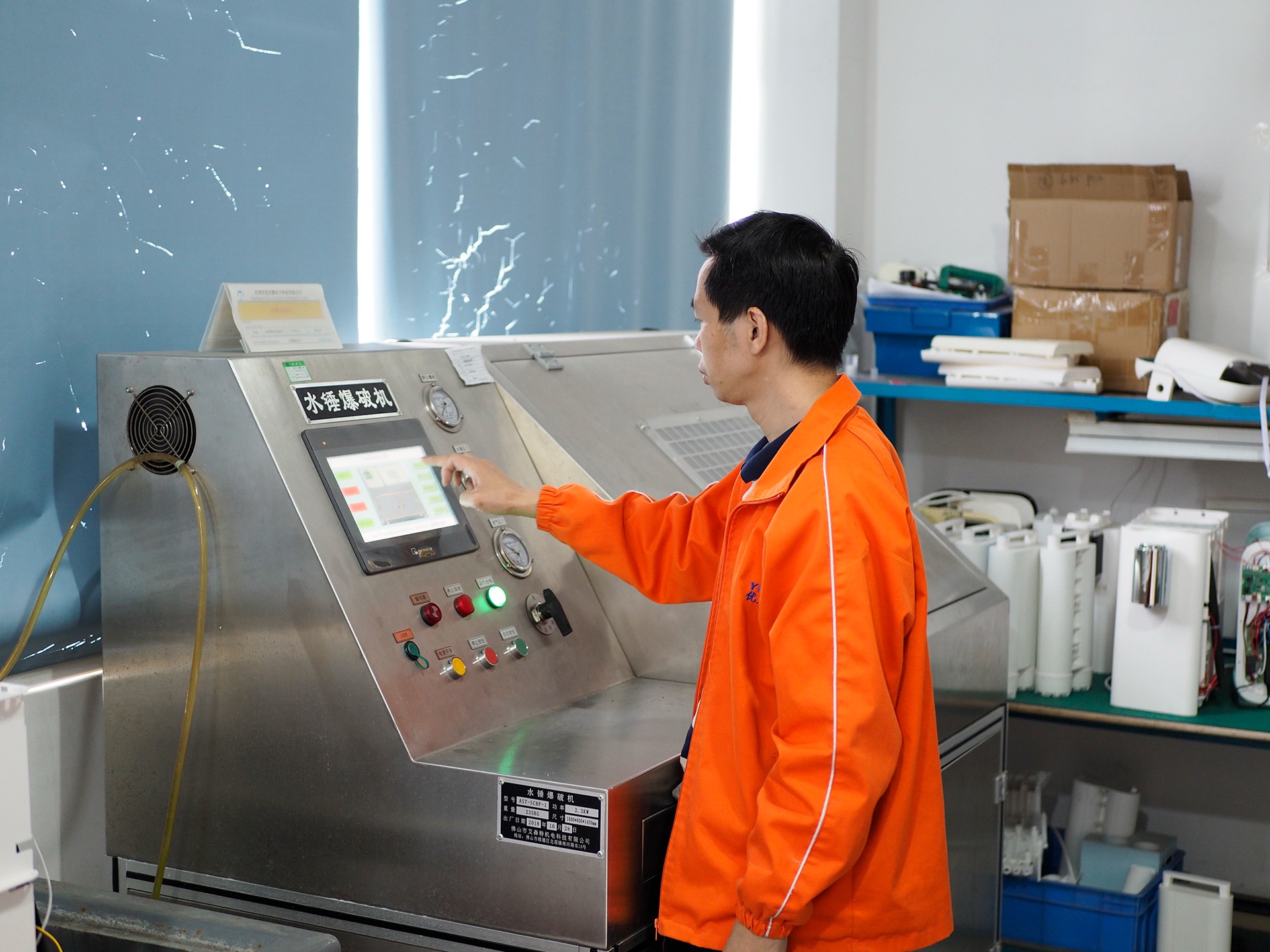 A technician running a water-system durability test.