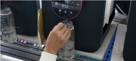 A water sample being checked against an operating appliance display.
